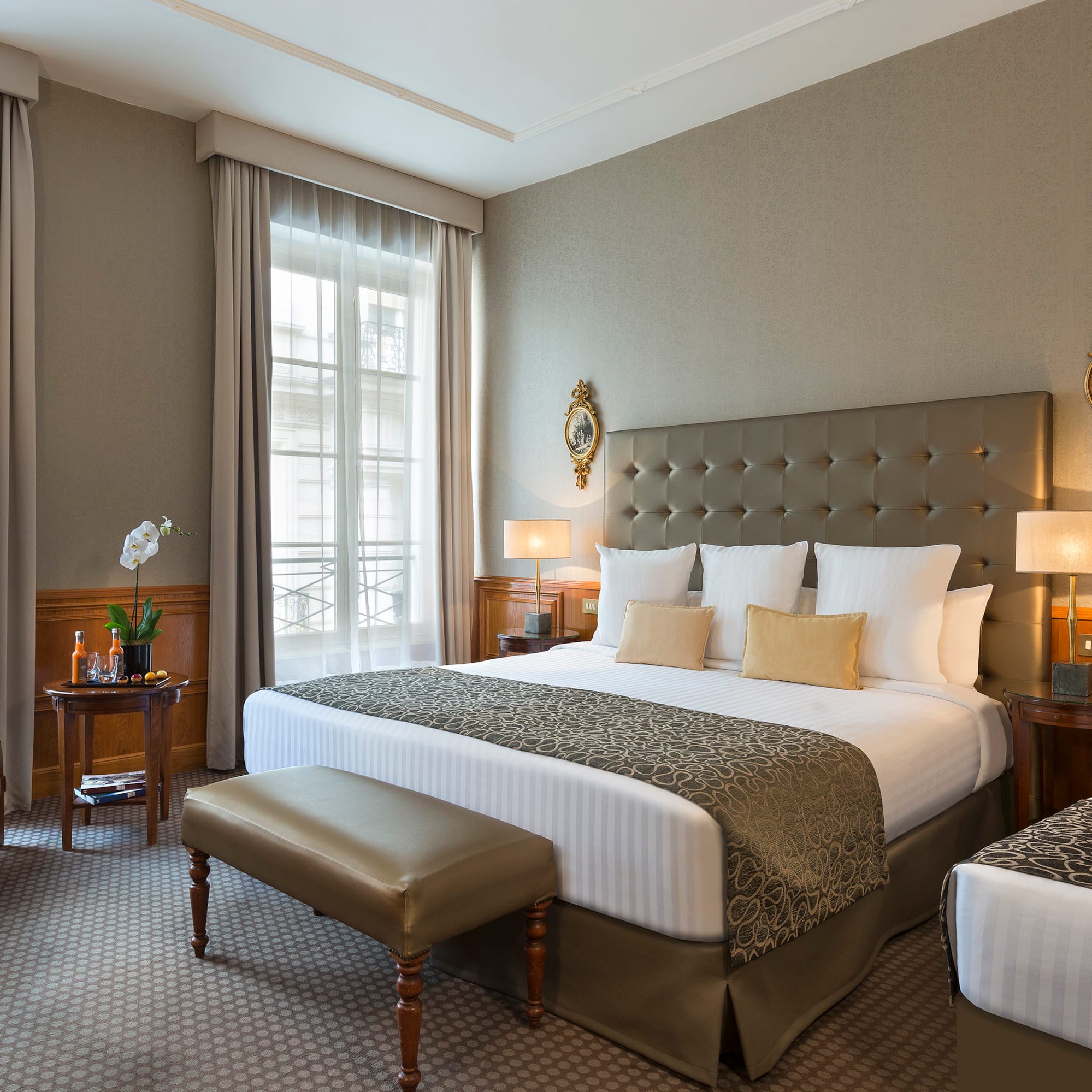 a bedroom with a bed and a table