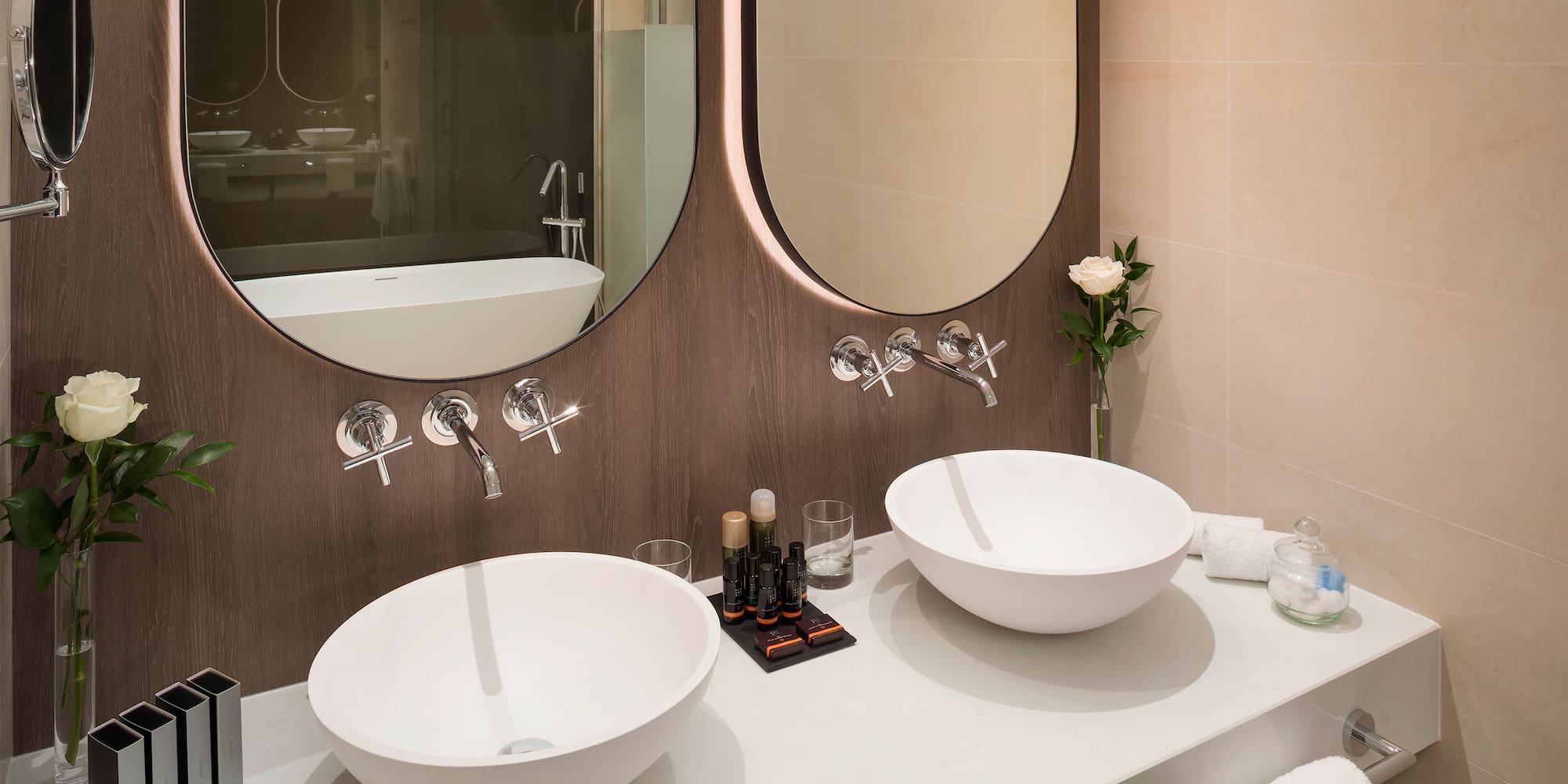 a bathroom with two sinks and a mirror