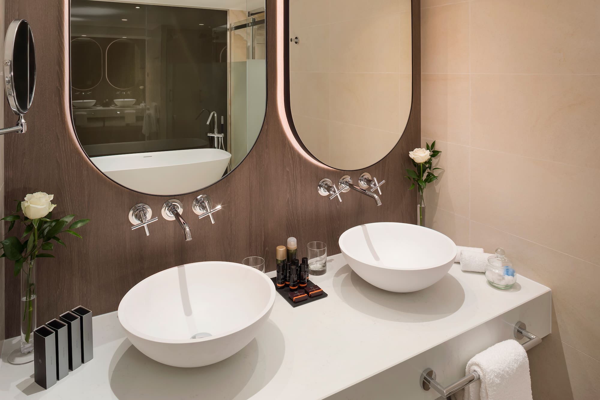a bathroom with two sinks and a mirror