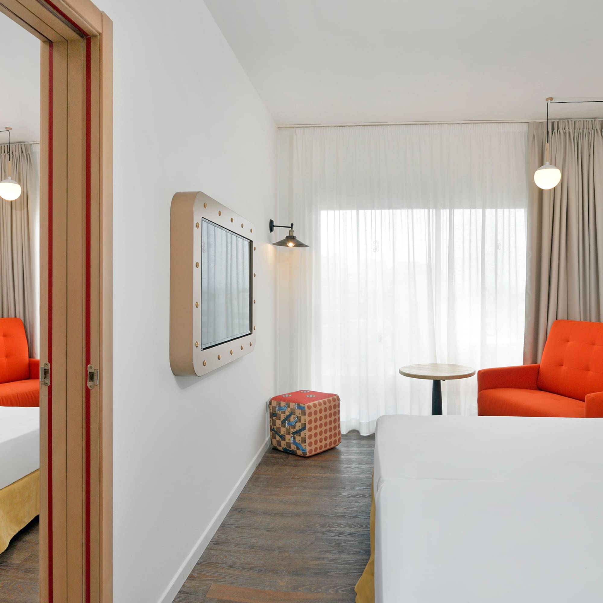 a room with a bed and a chair