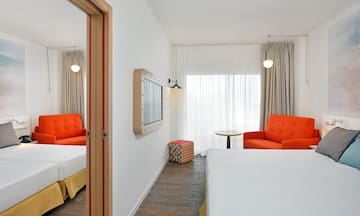 a room with a bed and a chair