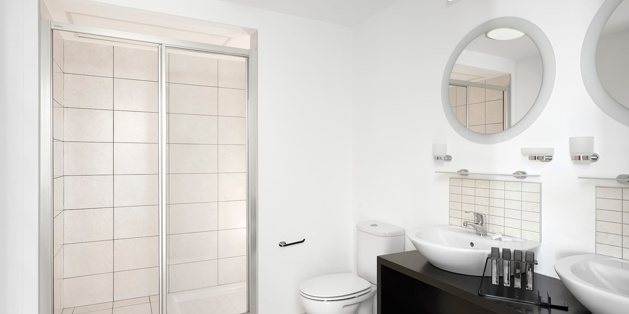 a bathroom with a shower and sink