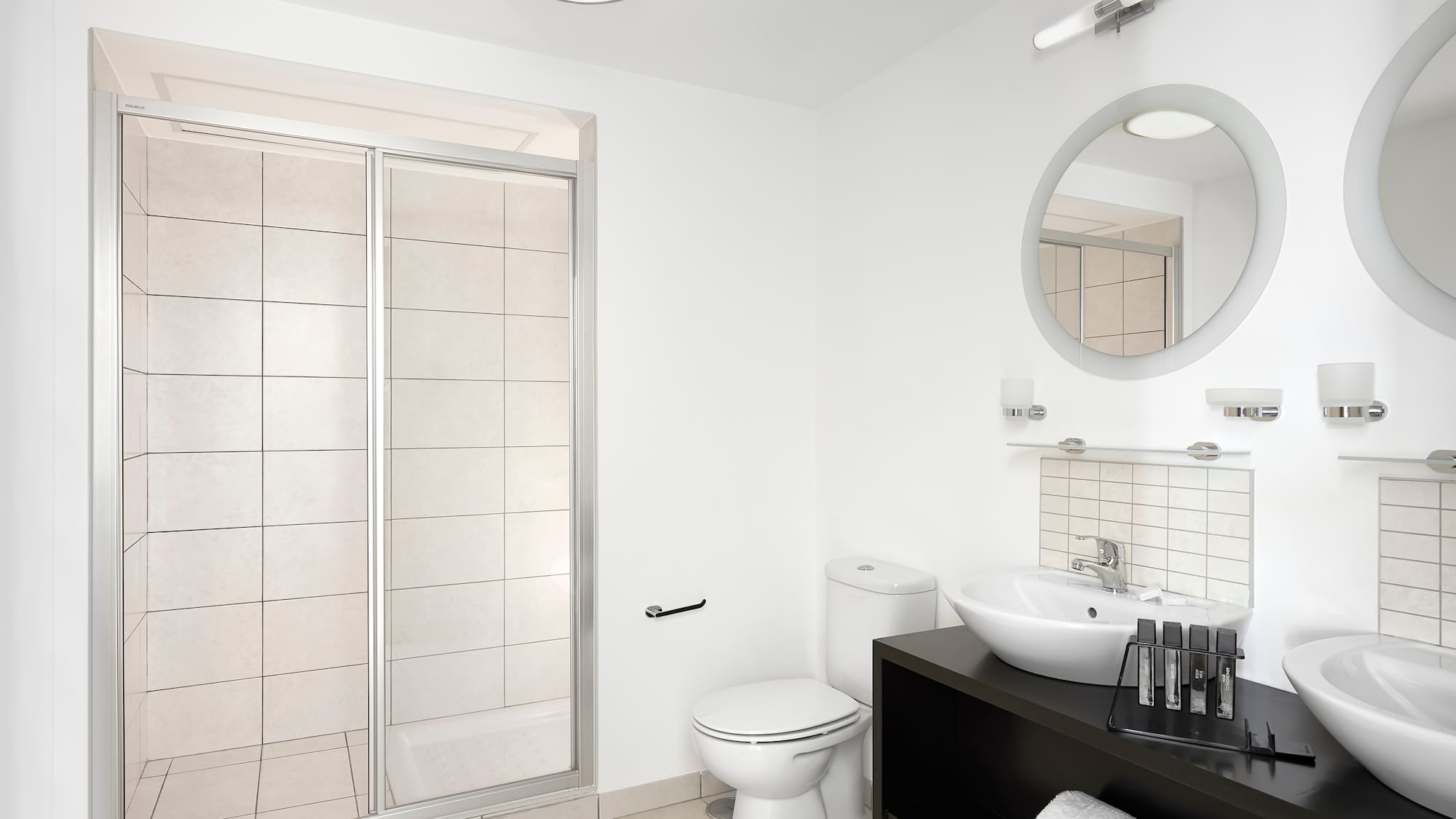 a bathroom with a shower and sink