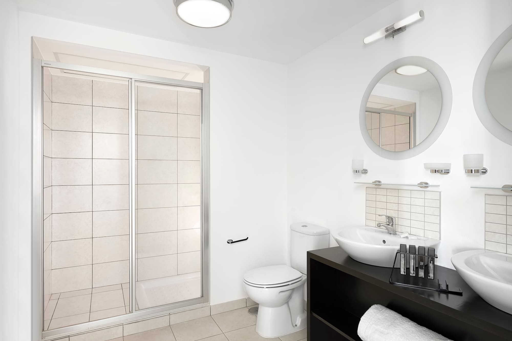 a bathroom with a shower and sink