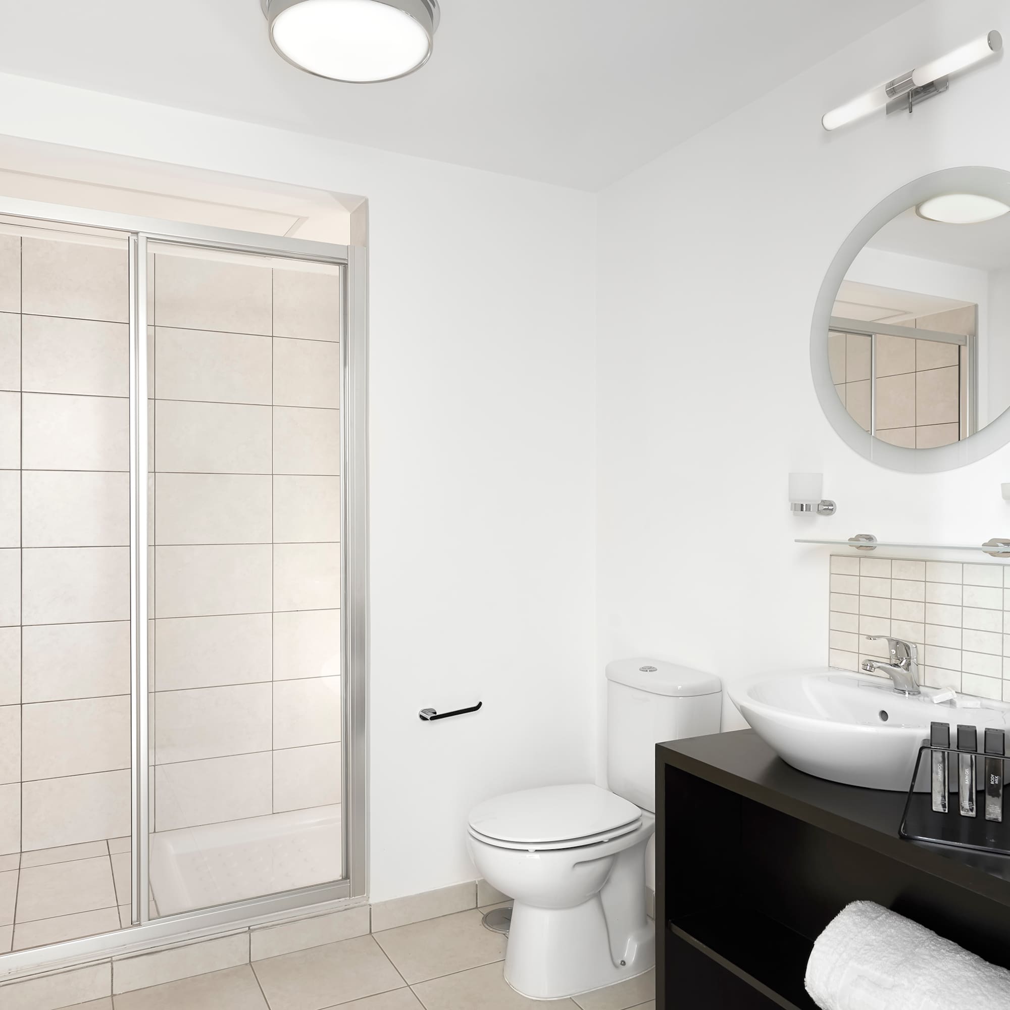 a bathroom with a shower and sink