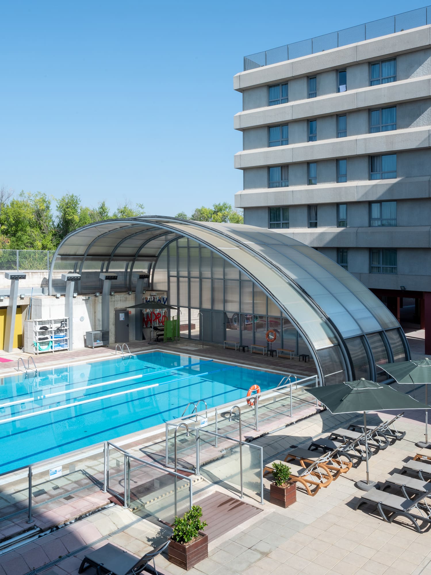 a swimming pool next to a building