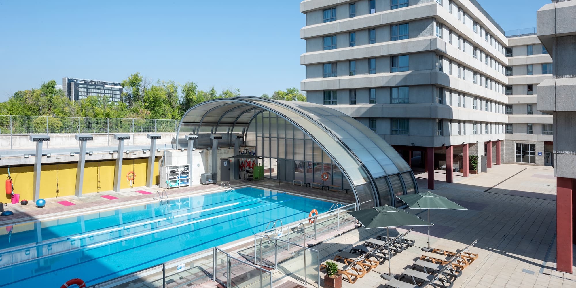 a swimming pool next to a building