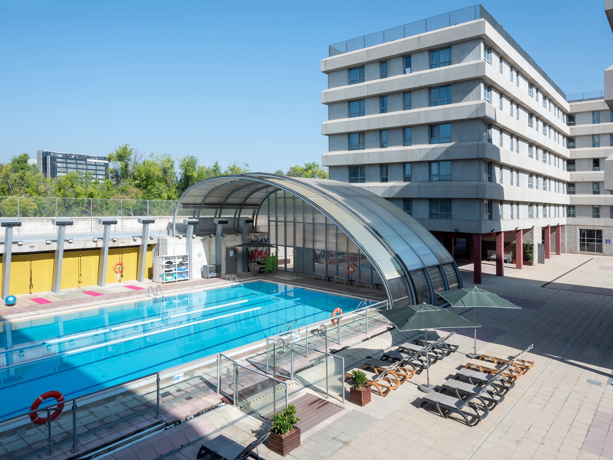 a swimming pool next to a building