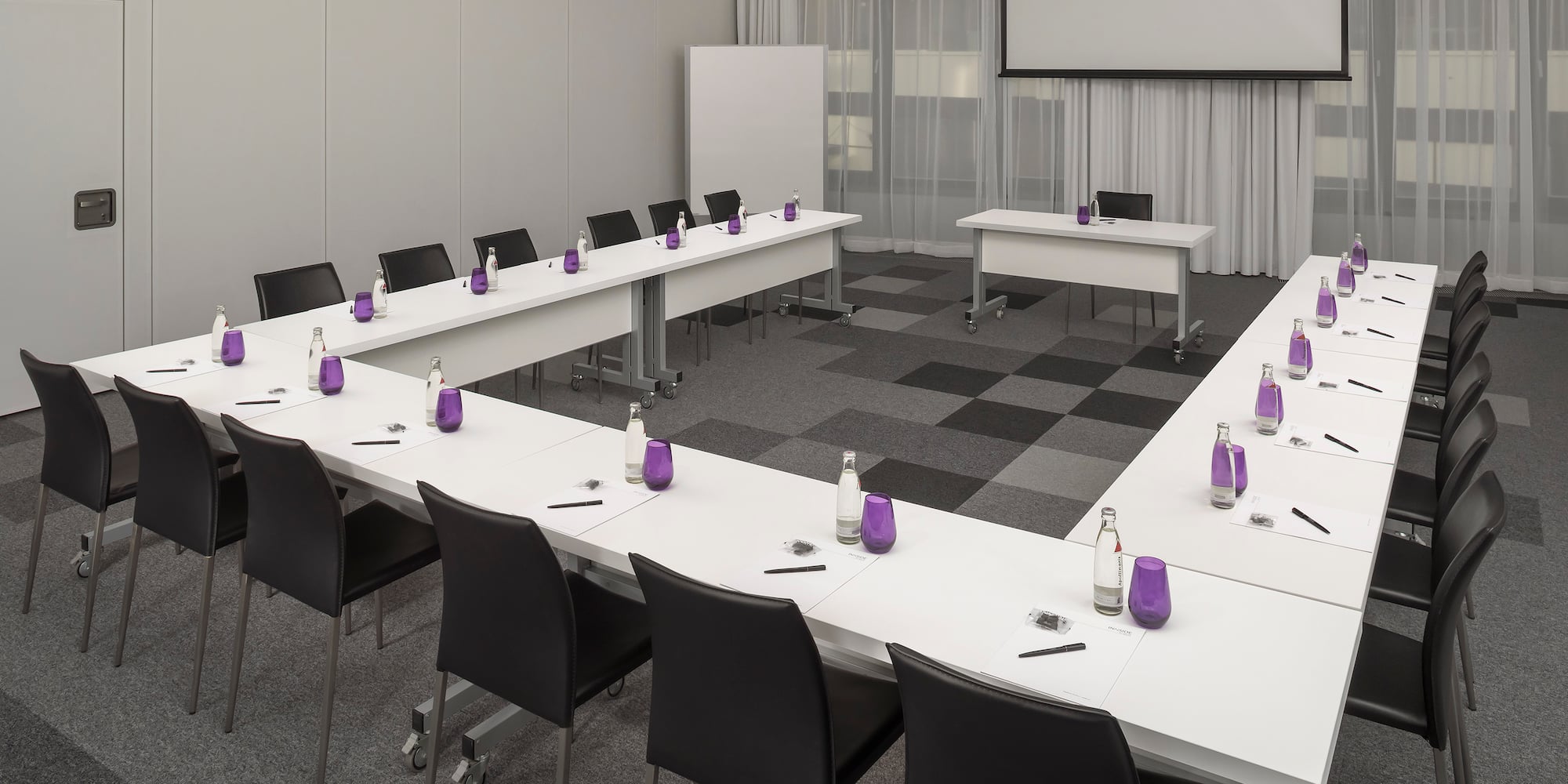 a room with tables and chairs