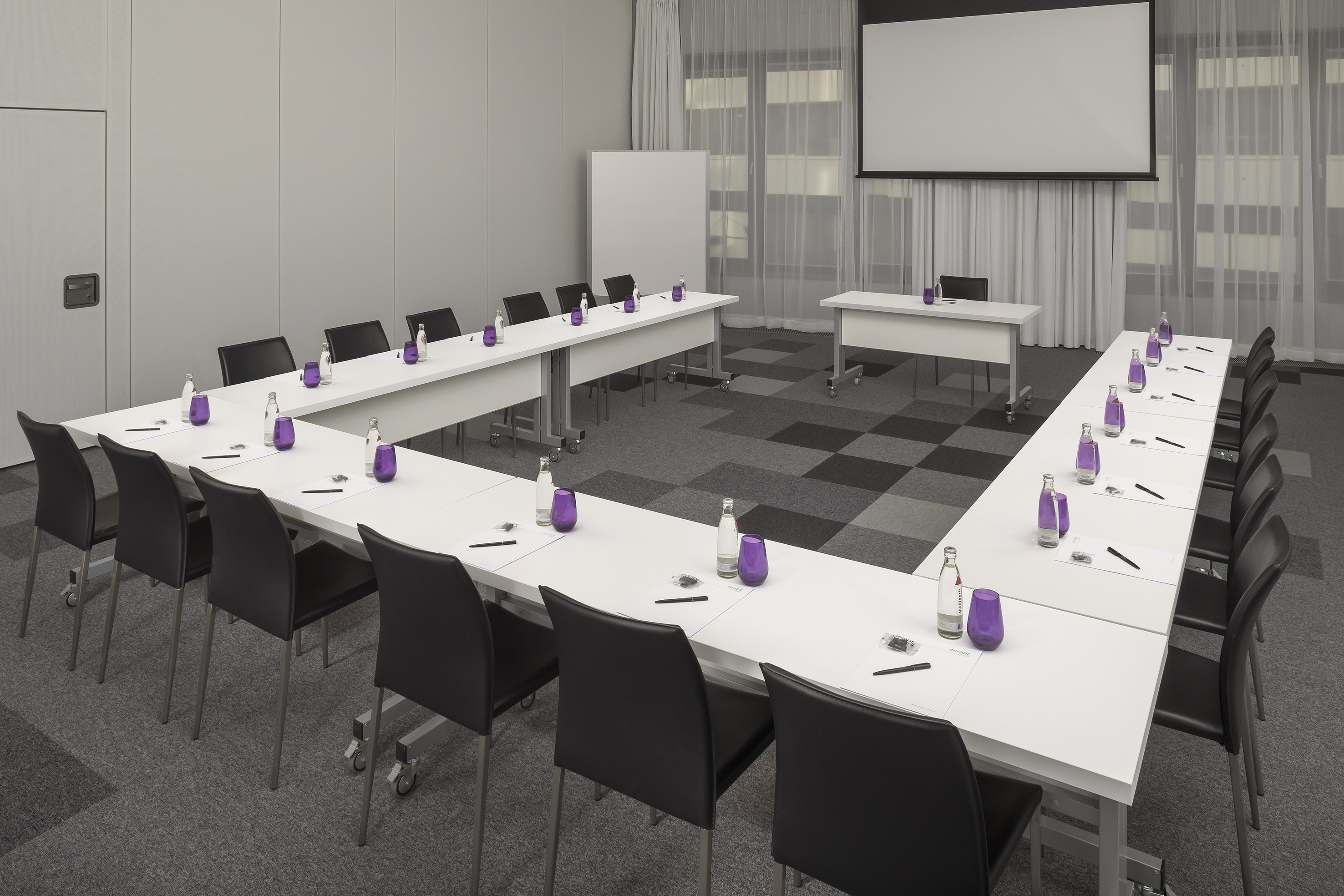 a room with tables and chairs