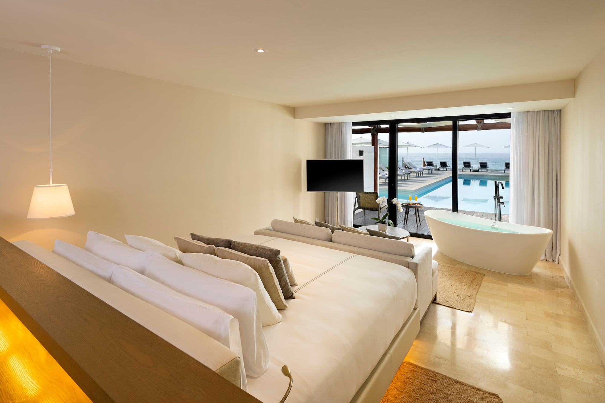 a room with a tub and a bed