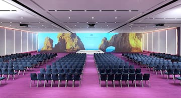 a room with rows of chairs