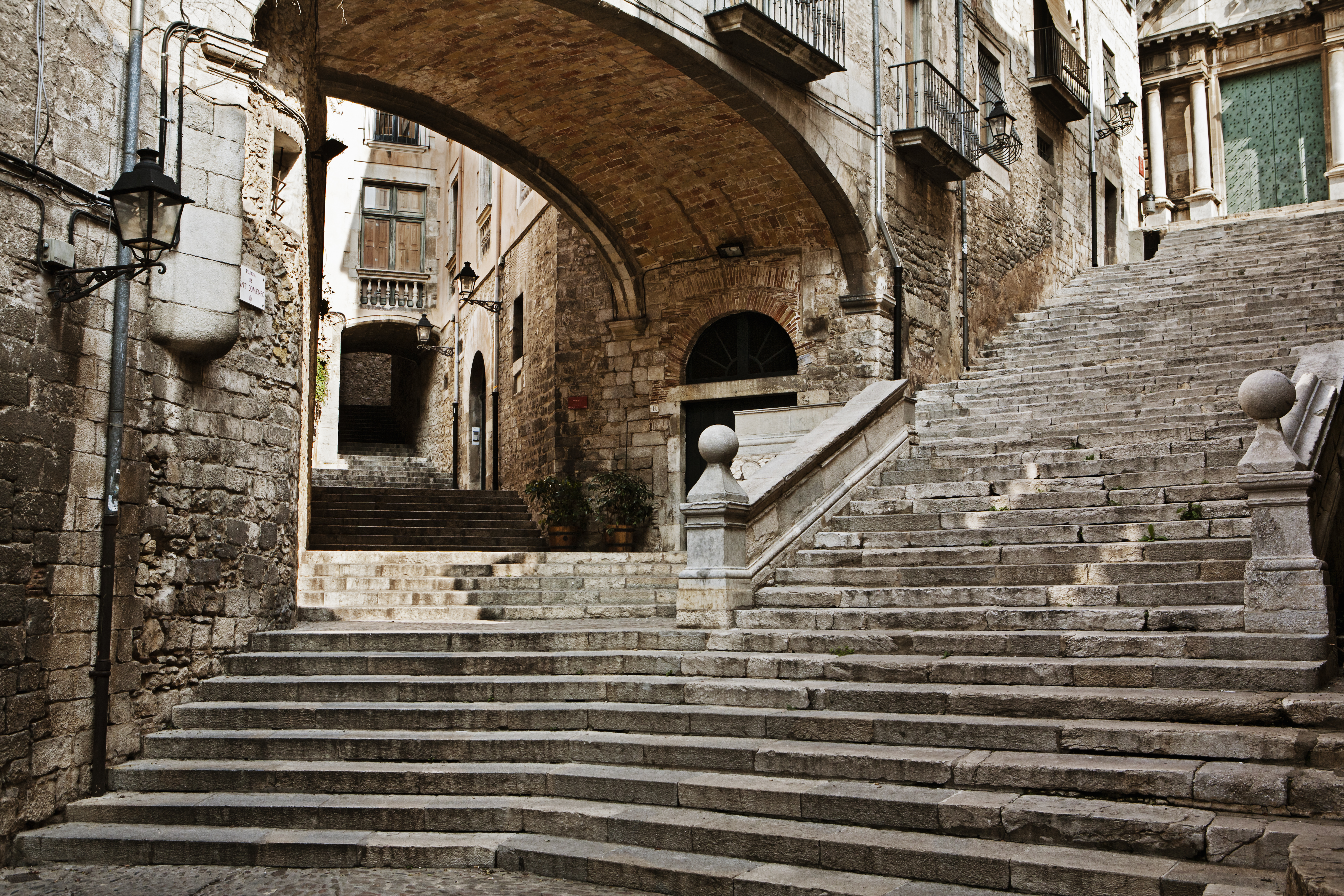 a stone stairs under a bridge