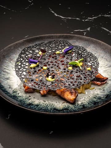a plate of food on a marbled surface