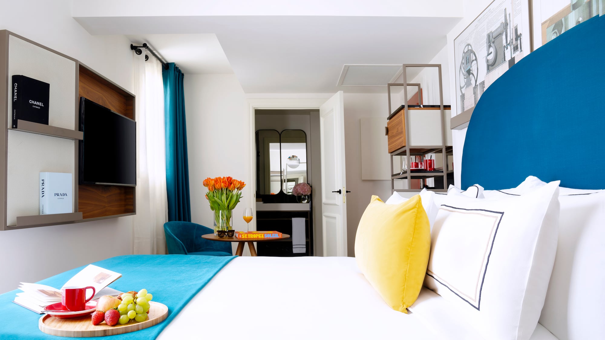 a room with a bed and a tv