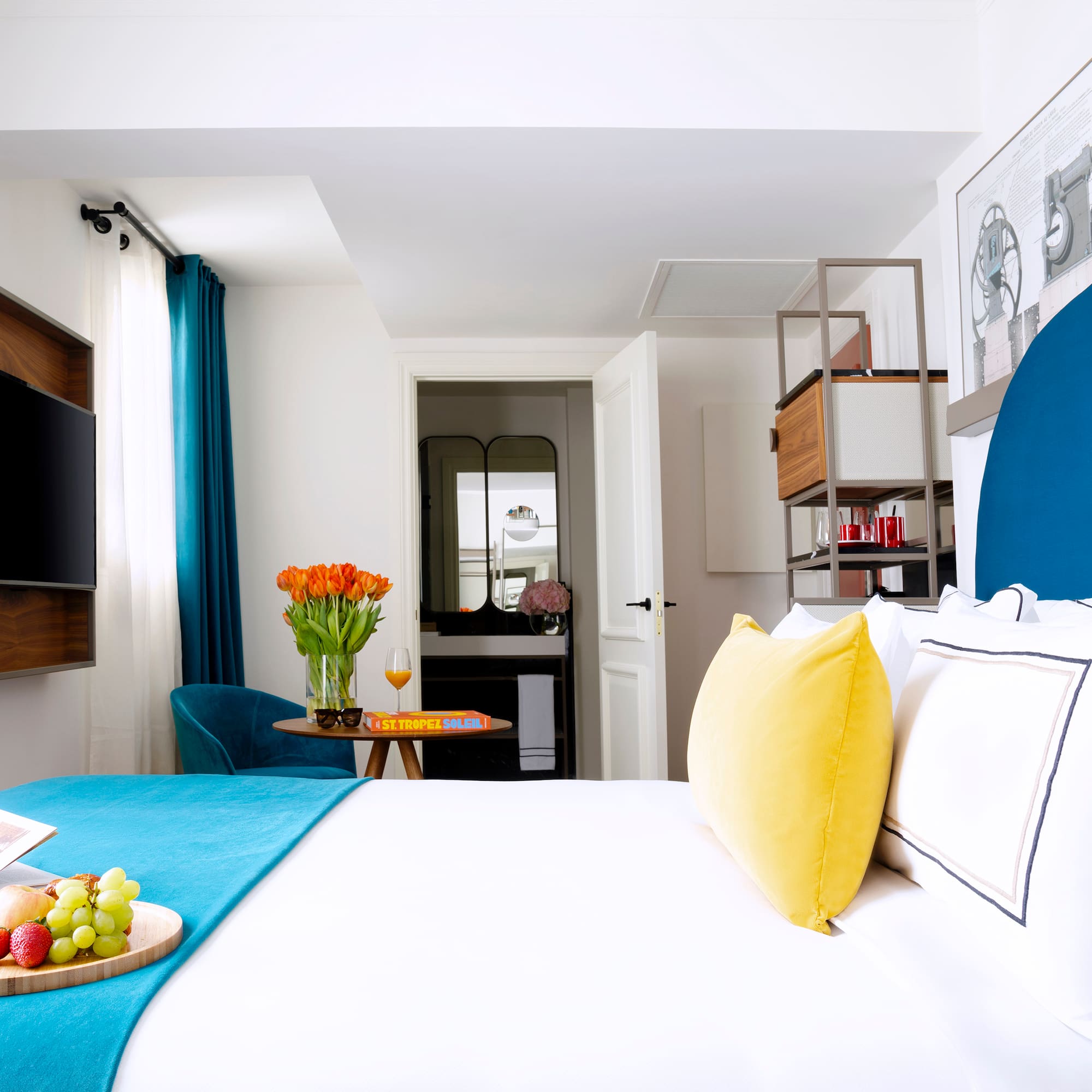 a room with a bed and a tv