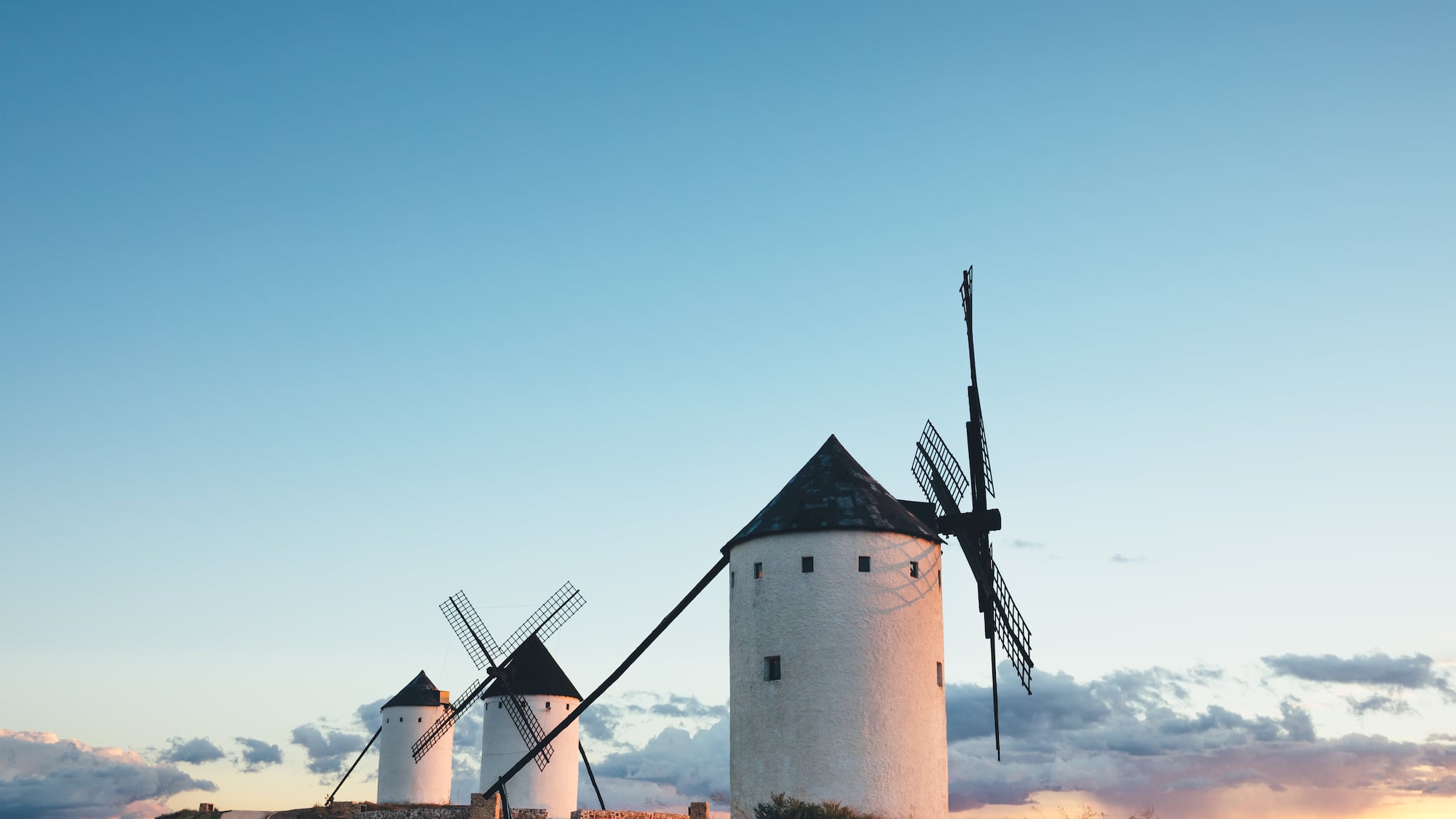 a group of windmills in a field