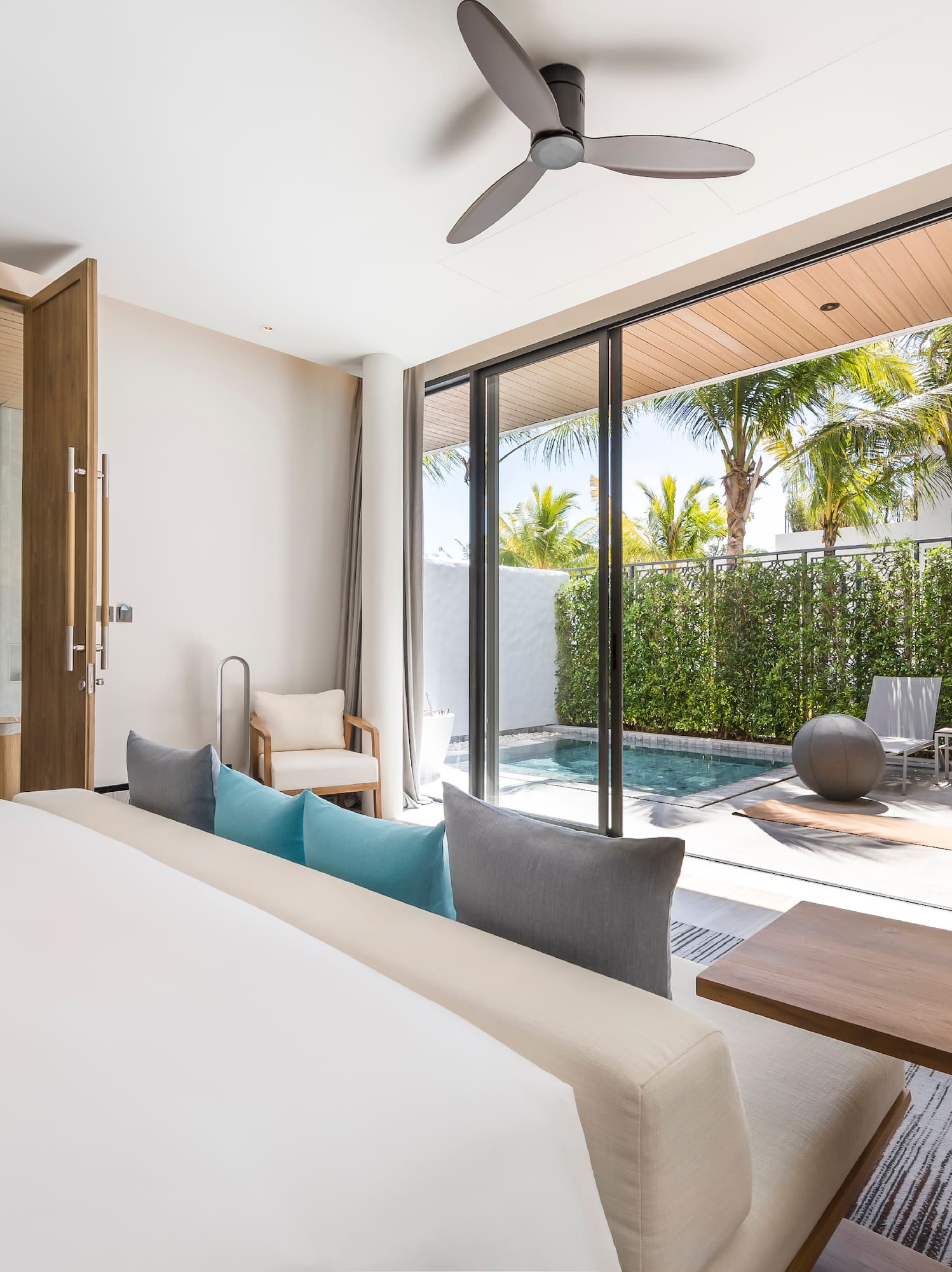 a room with a bed and a pool