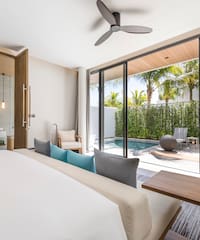 a room with a bed and a pool