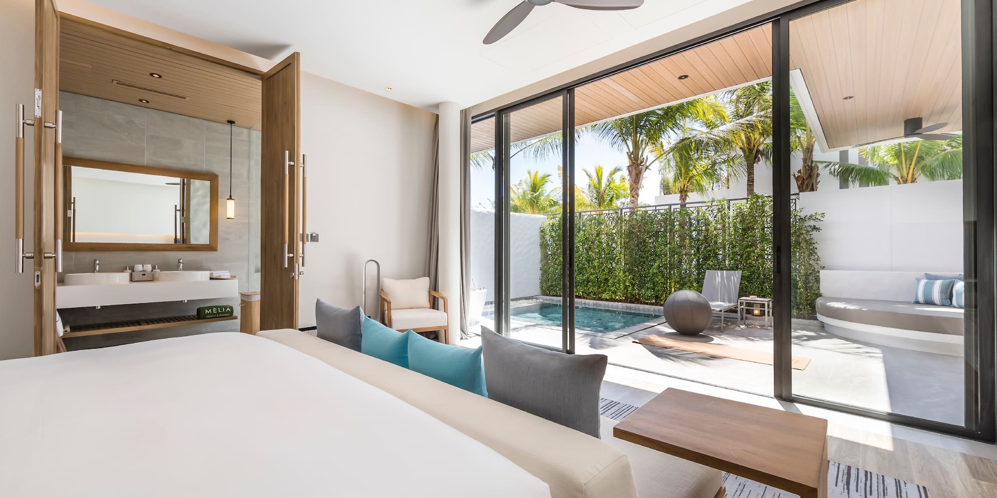 a room with a bed and a pool