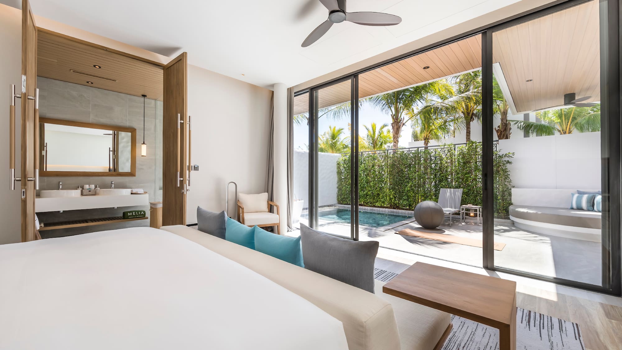 a room with a bed and a pool