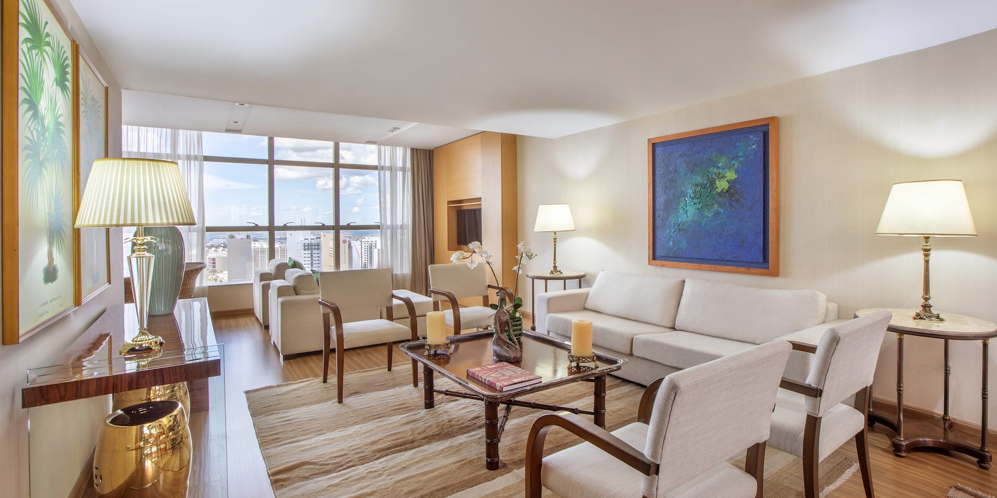 a living room with a couch and chairs