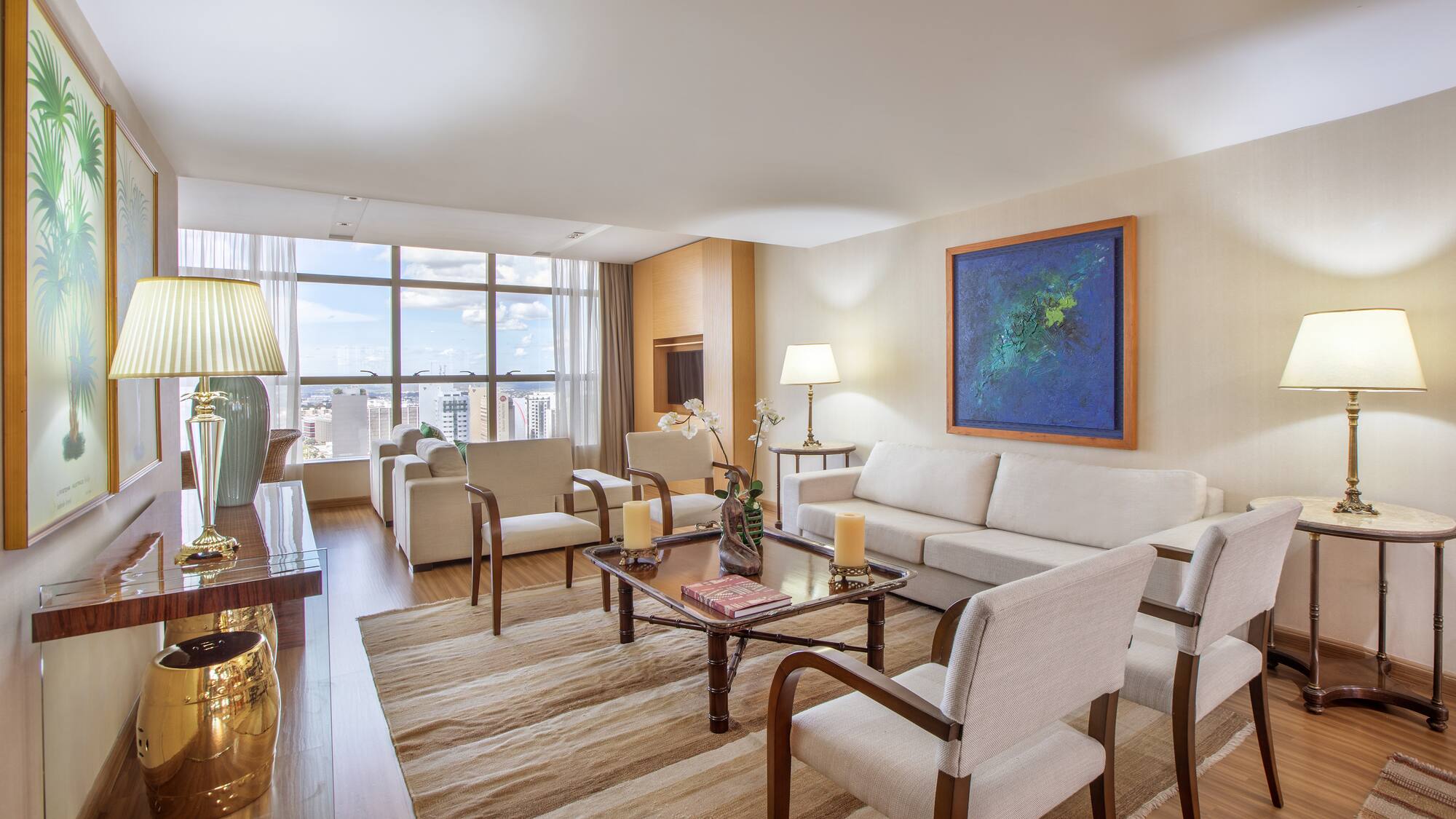 a living room with a couch and chairs