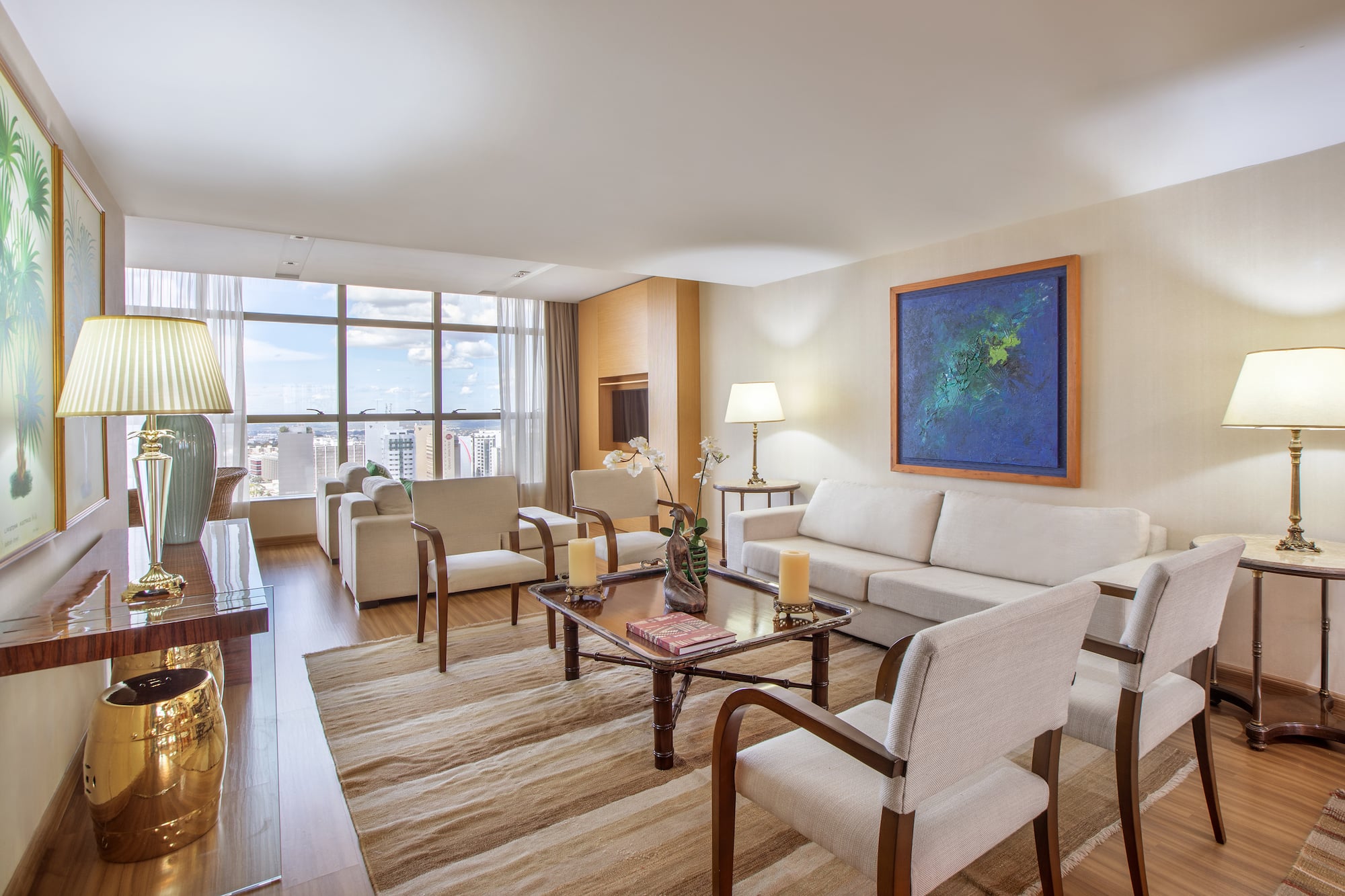 a living room with a couch and chairs