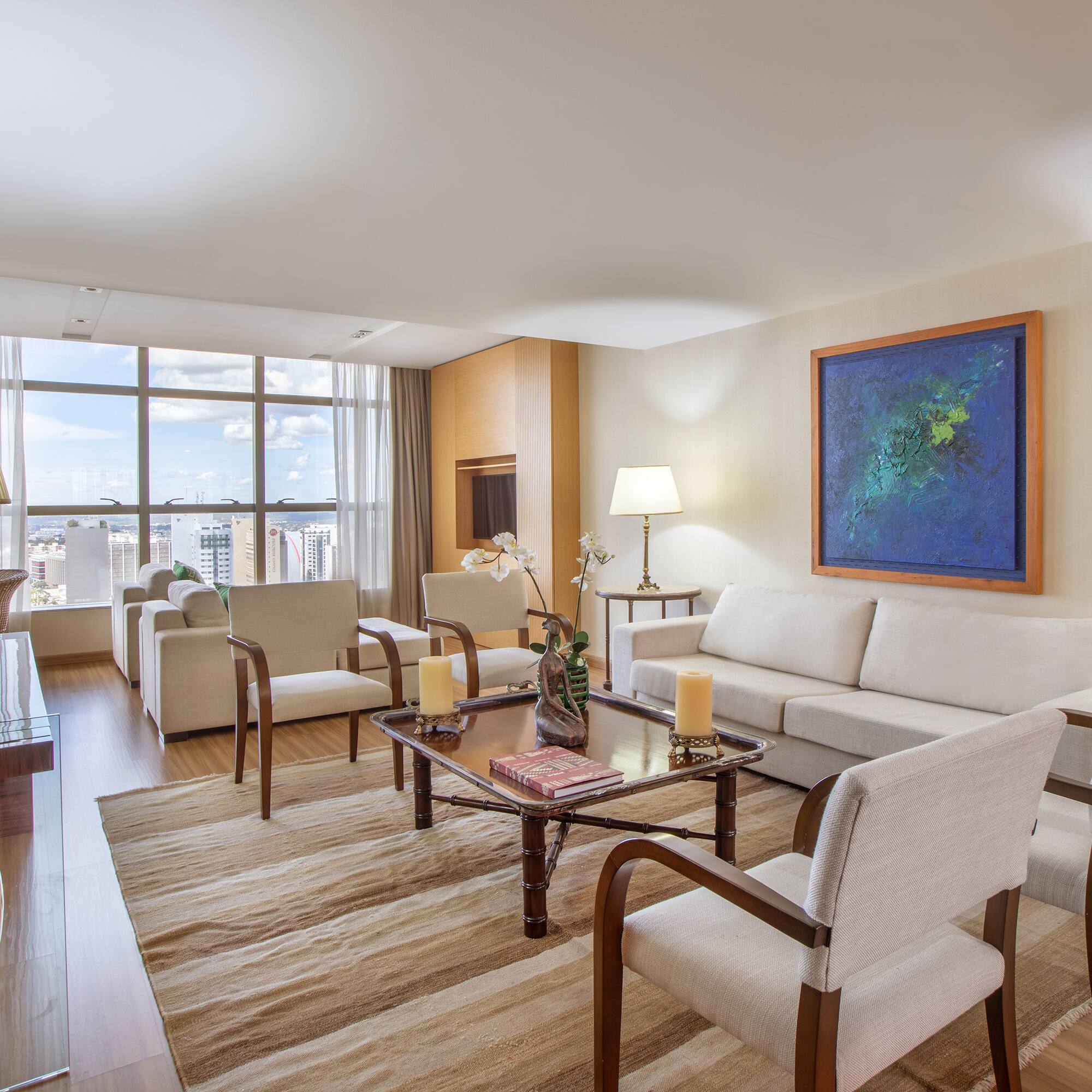 a living room with a couch and chairs