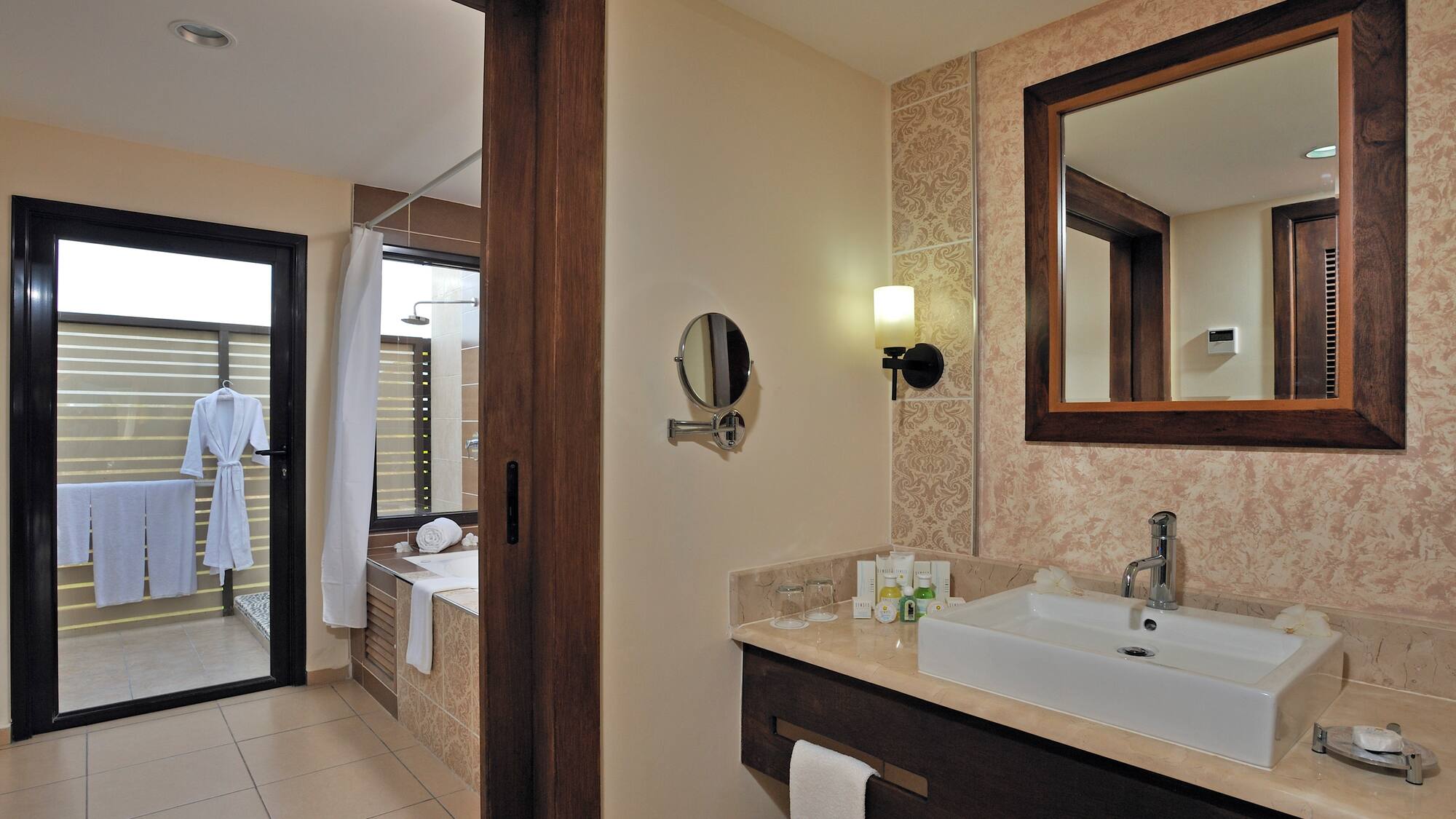 a bathroom with a mirror and sink