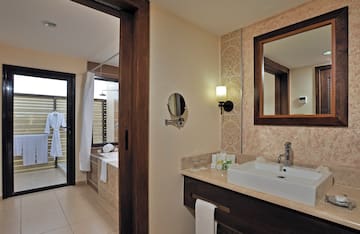 a bathroom with a mirror and sink