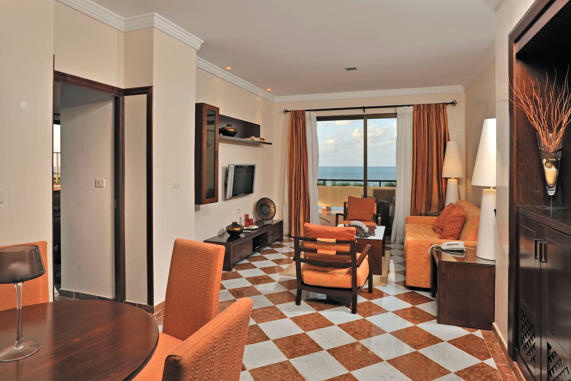 a room with a checkered floor and a couch