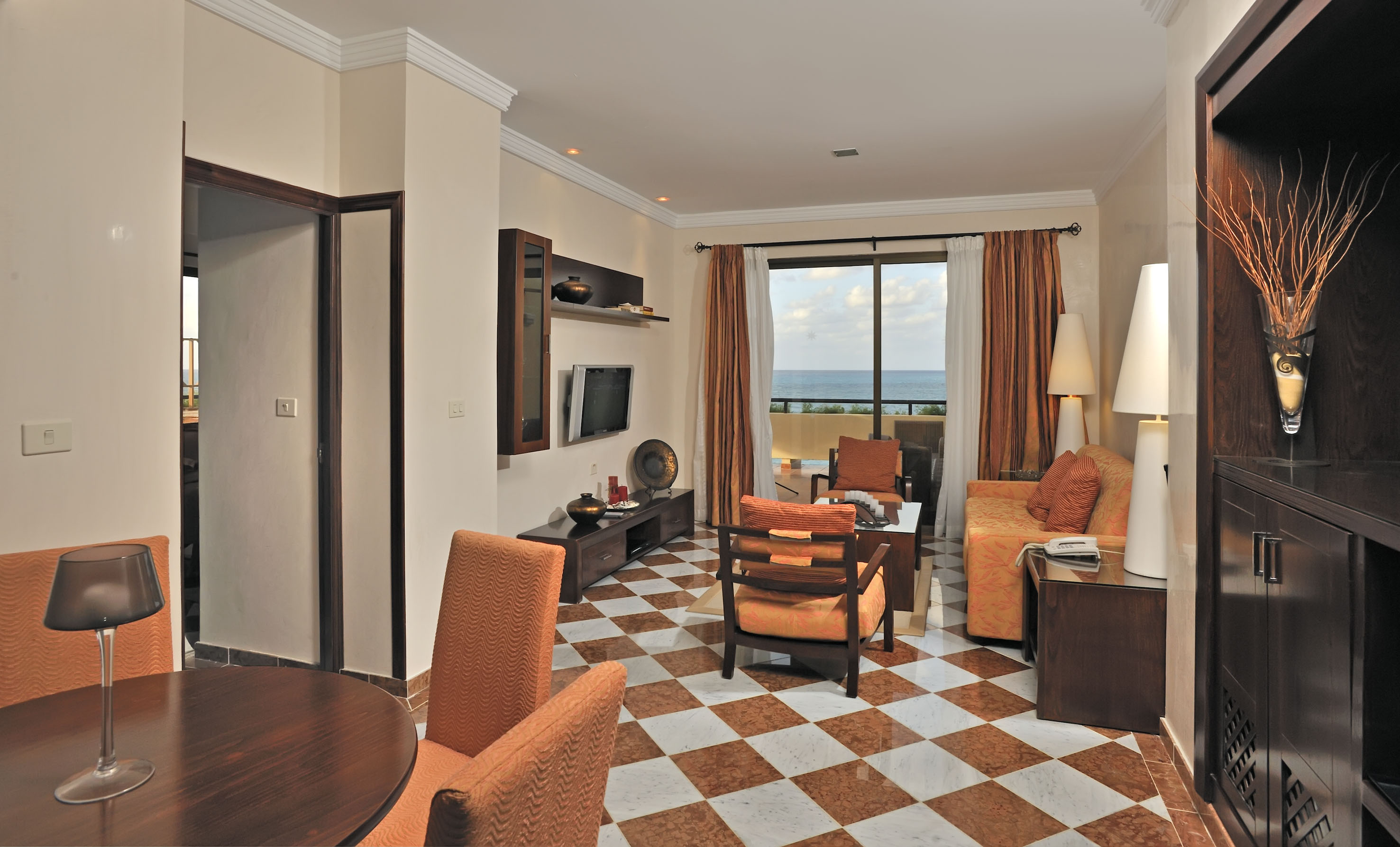 a room with a checkered floor and a couch