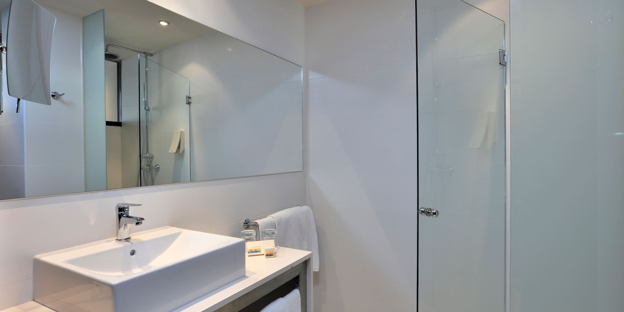 a bathroom with a mirror and sink