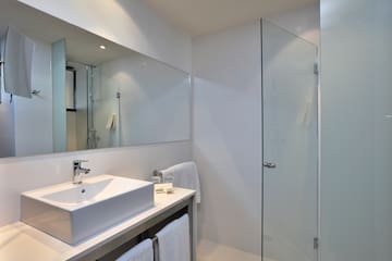 a bathroom with a mirror and sink