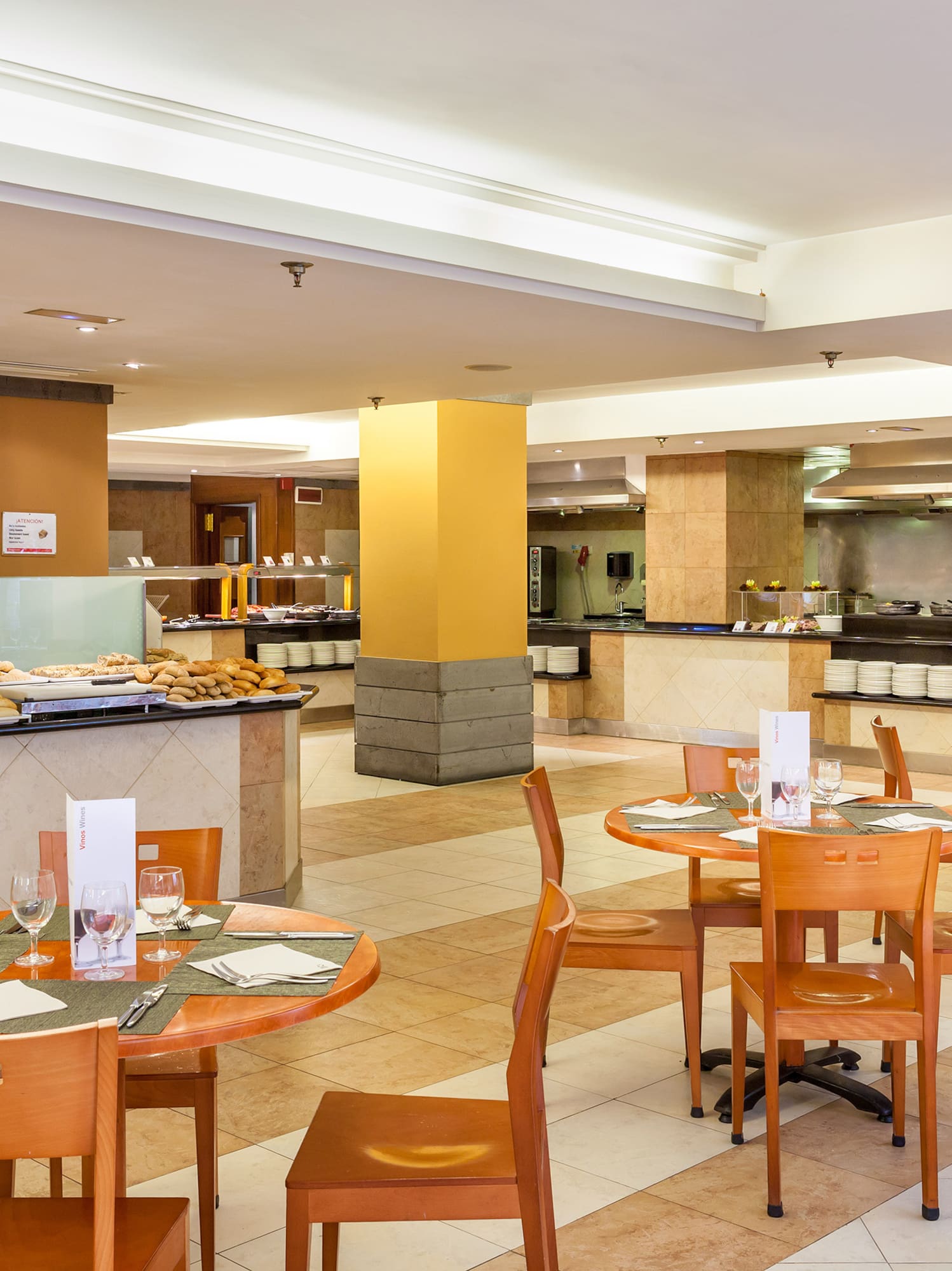 a restaurant with a chef in the background