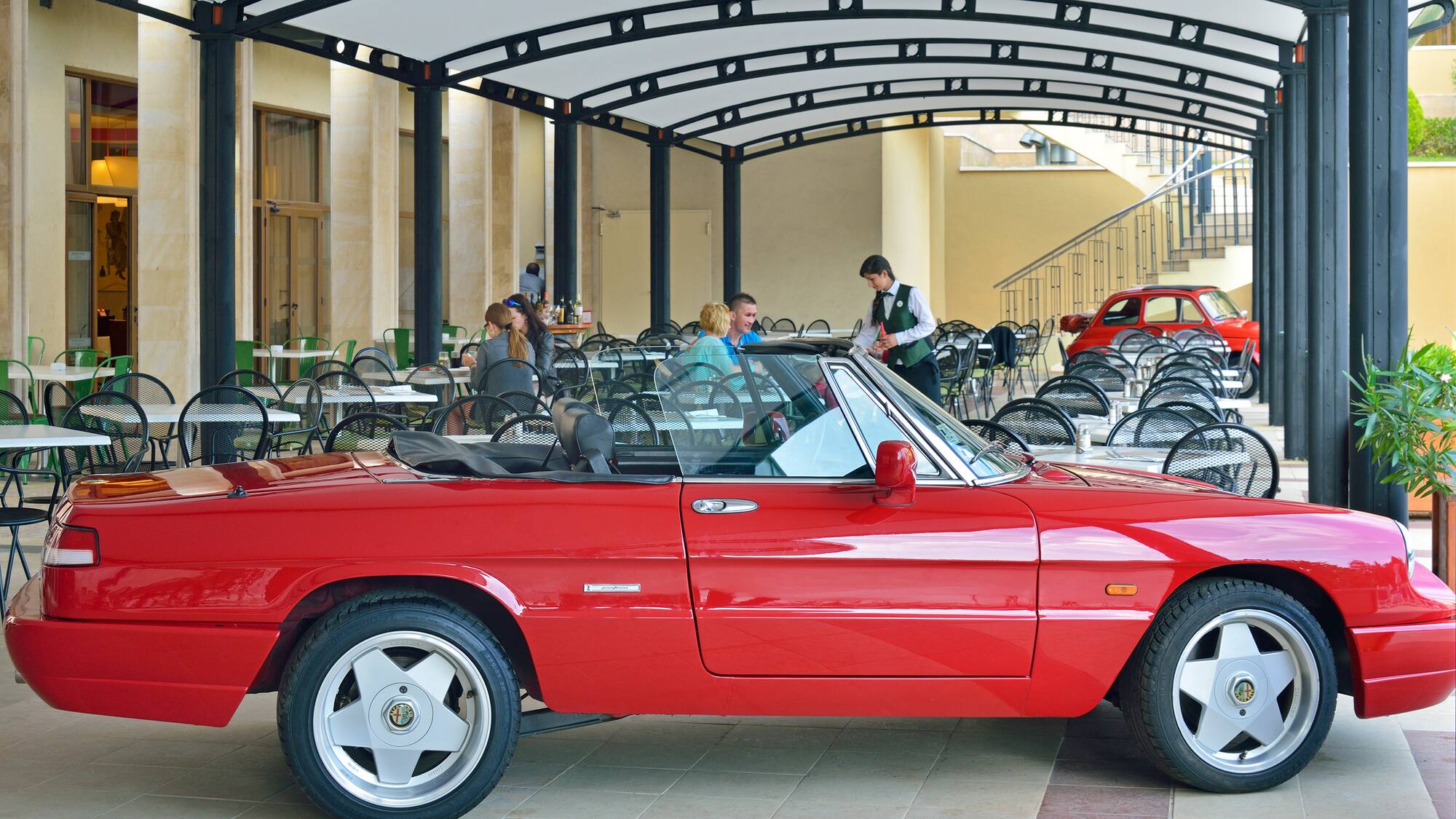 a red car parked in a restaurant