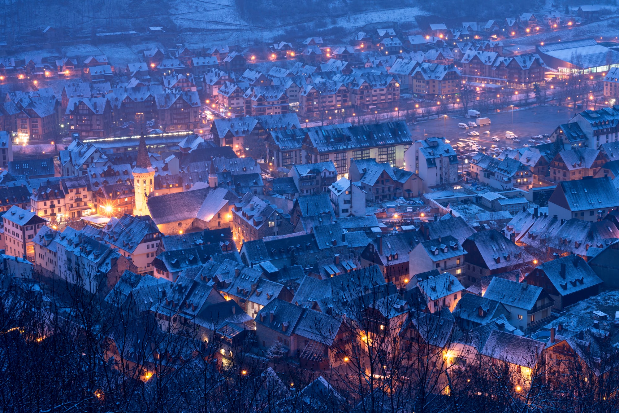 a city with snow on the roof