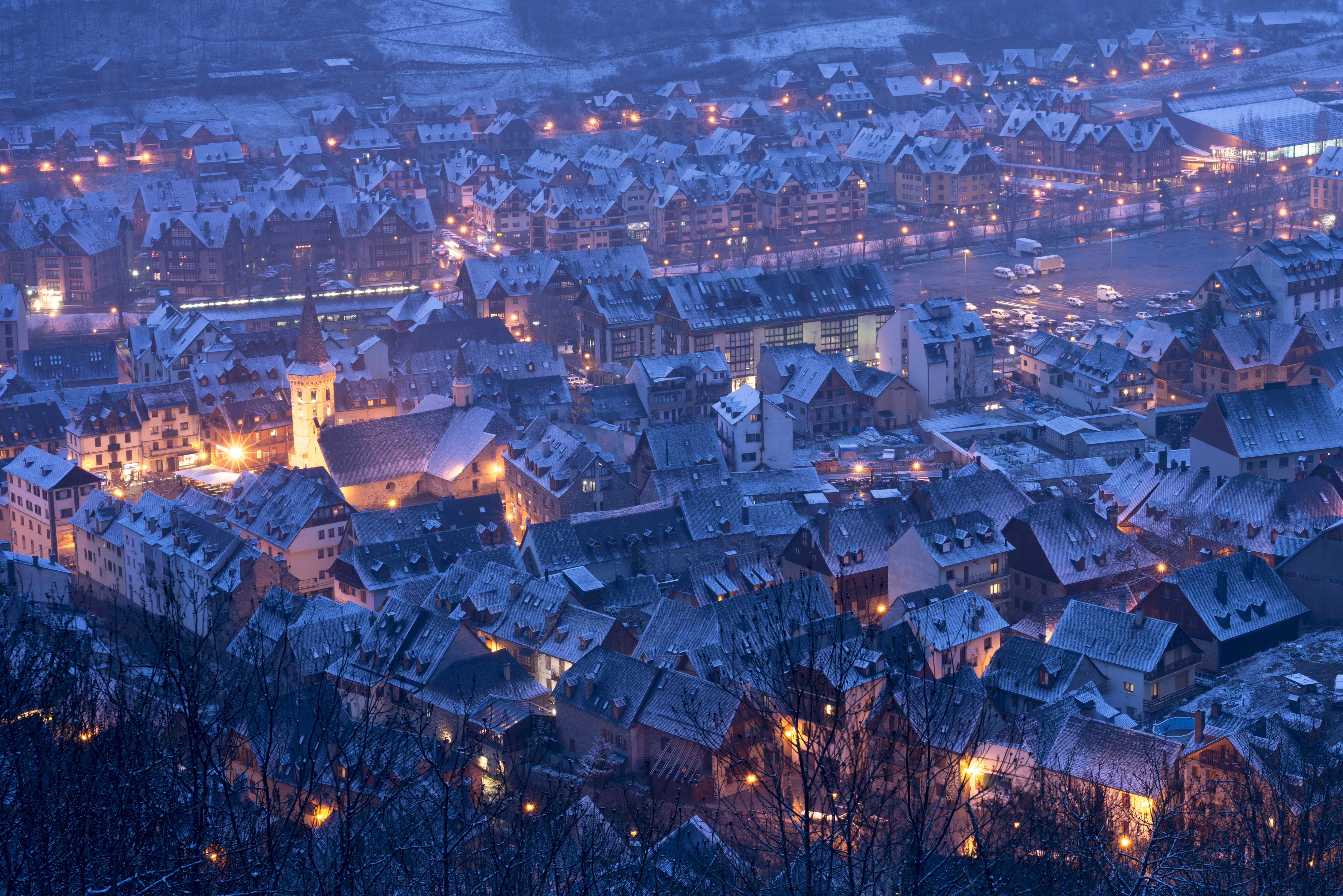 a city with snow on the roof