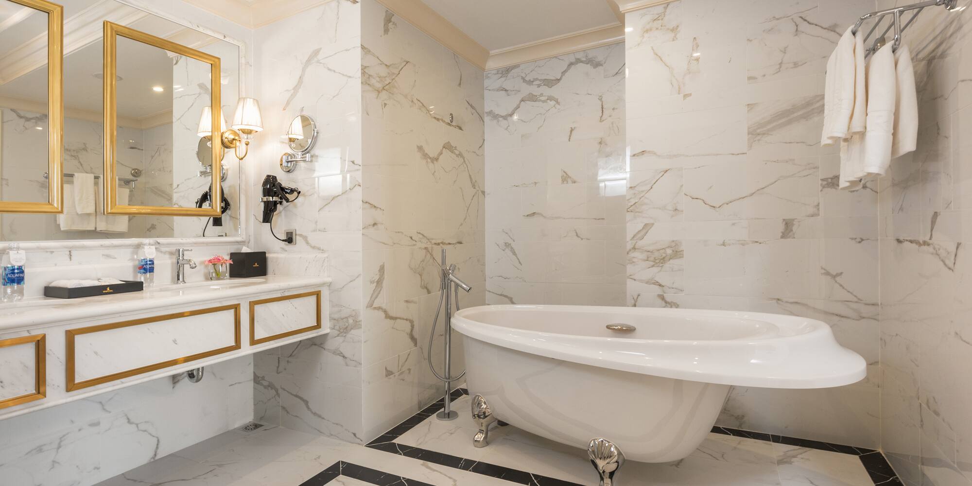 a bathroom with a tub and sink