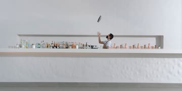 a man juggling a can on a counter