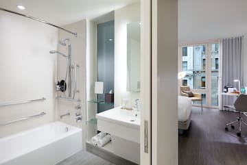 a bathroom with a bathtub and shower