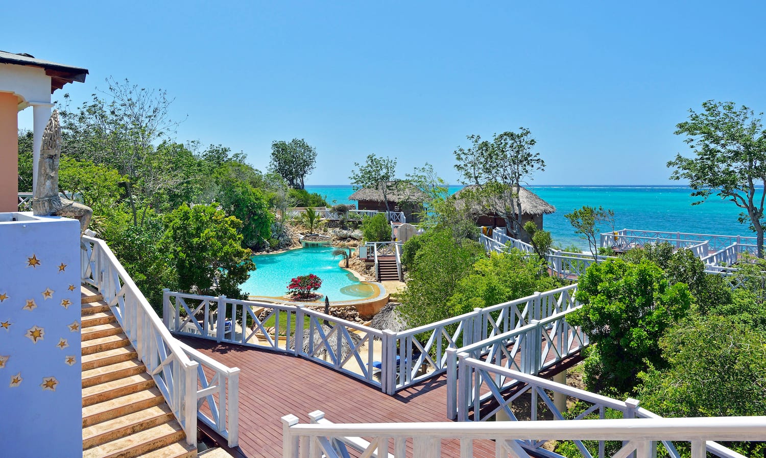 a deck with a pool and trees