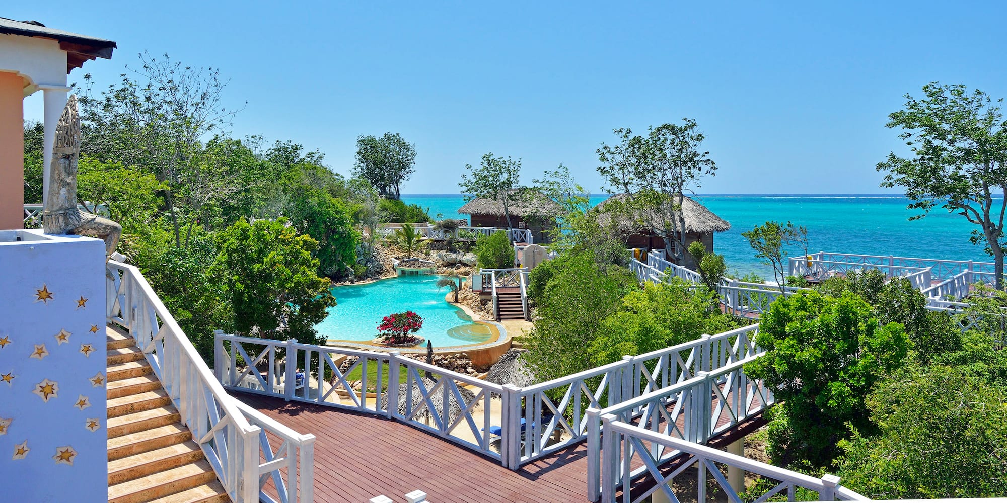 a deck with a pool and trees