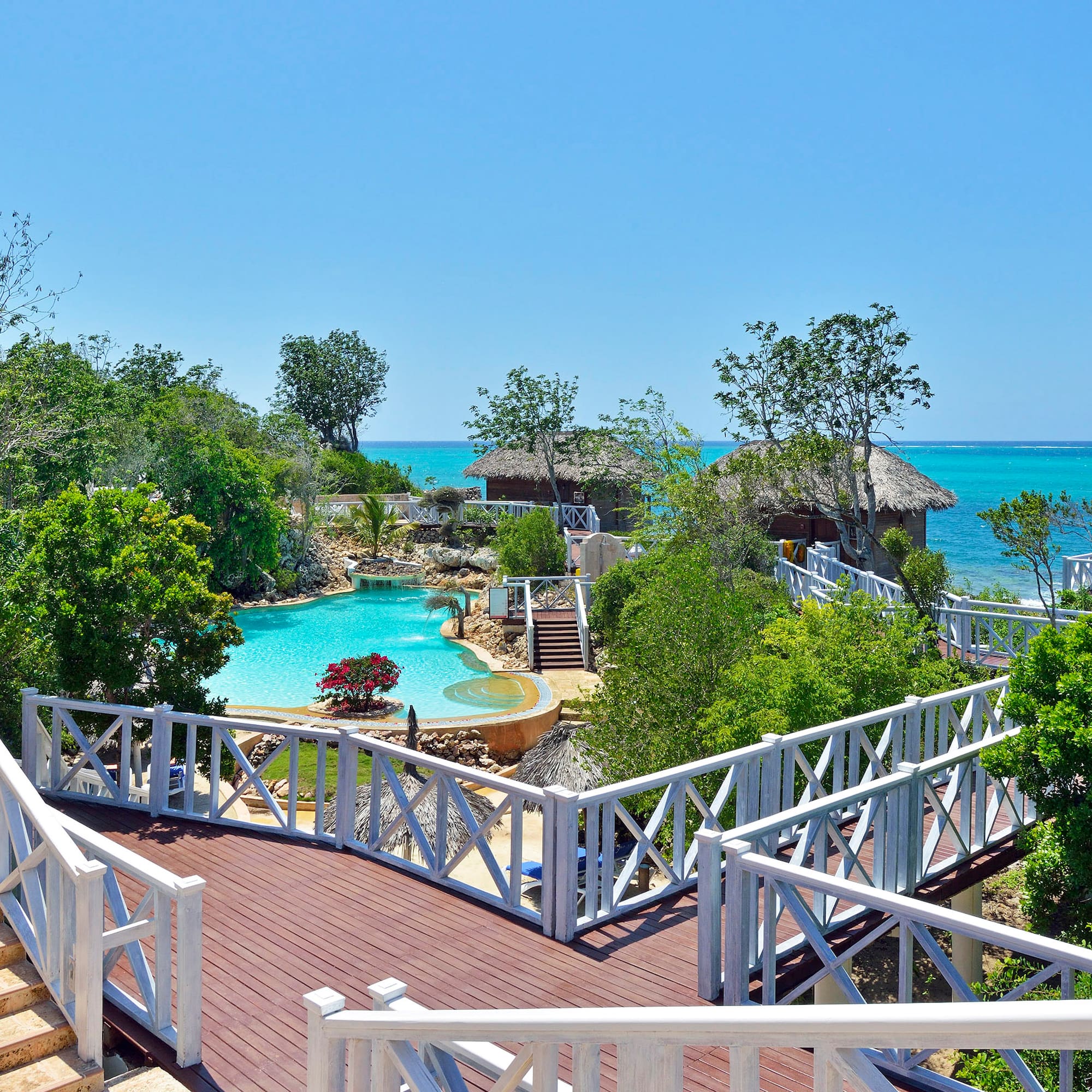 a deck with a pool and trees