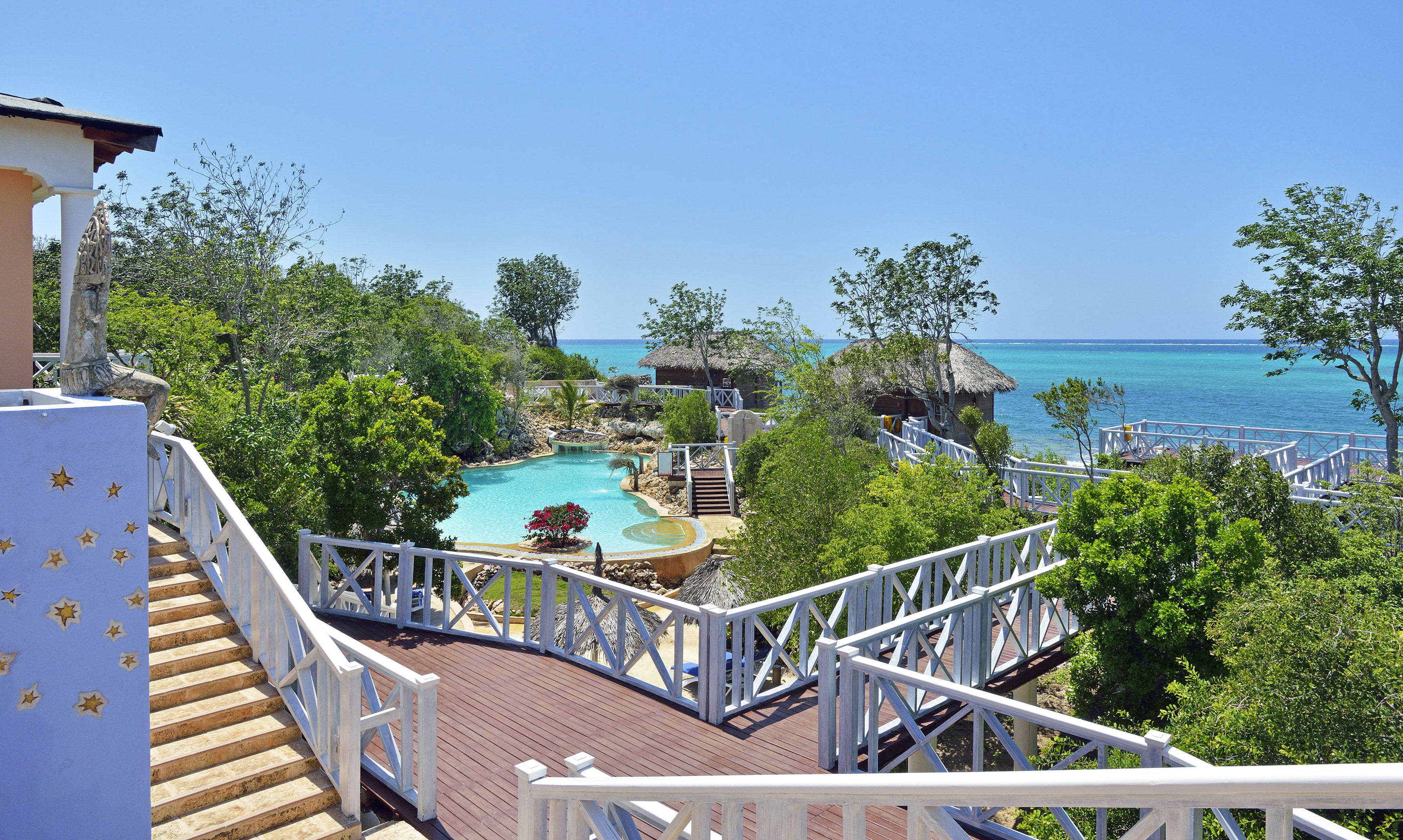 a deck with a pool and trees