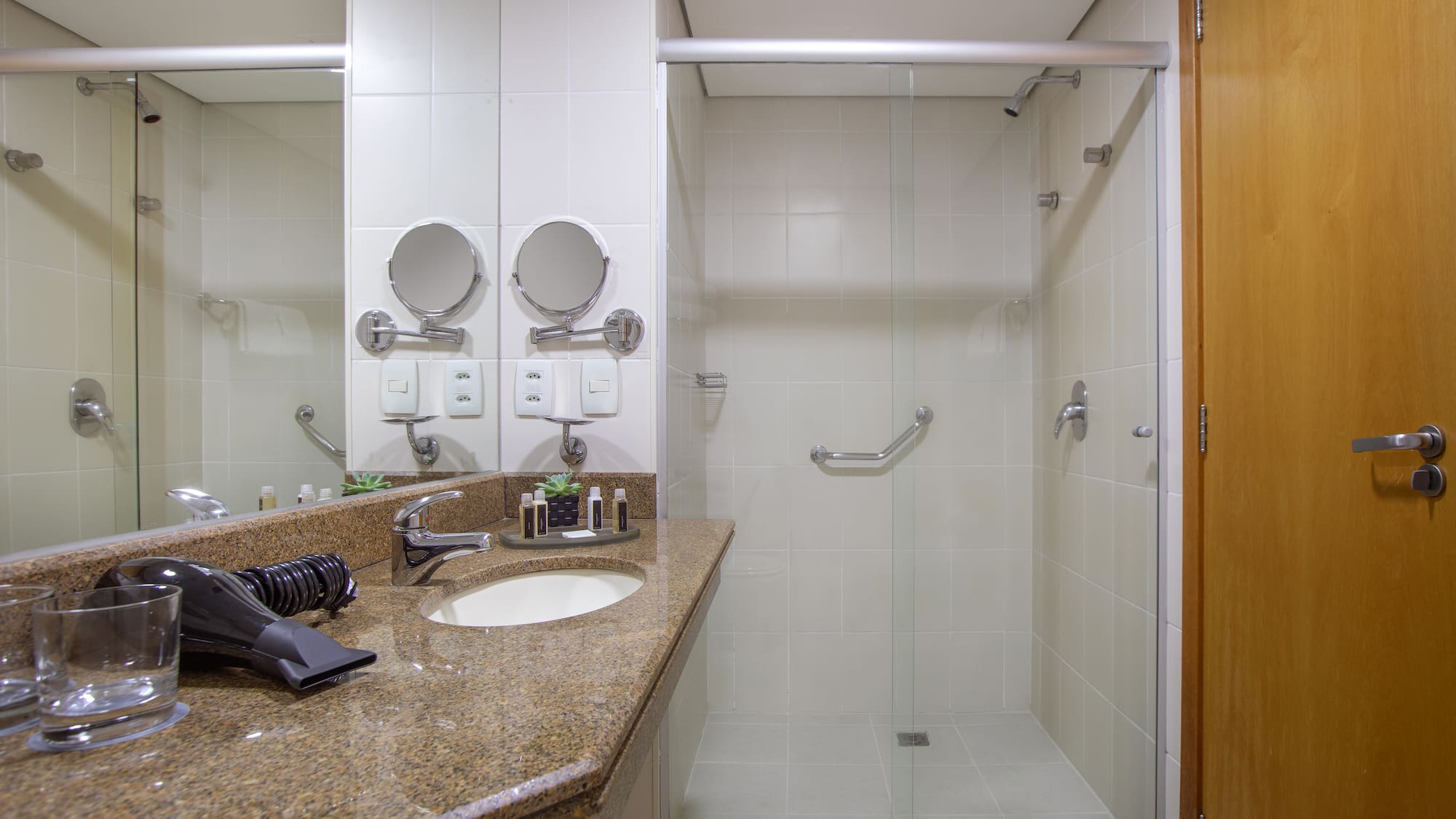 a bathroom with a shower and sink