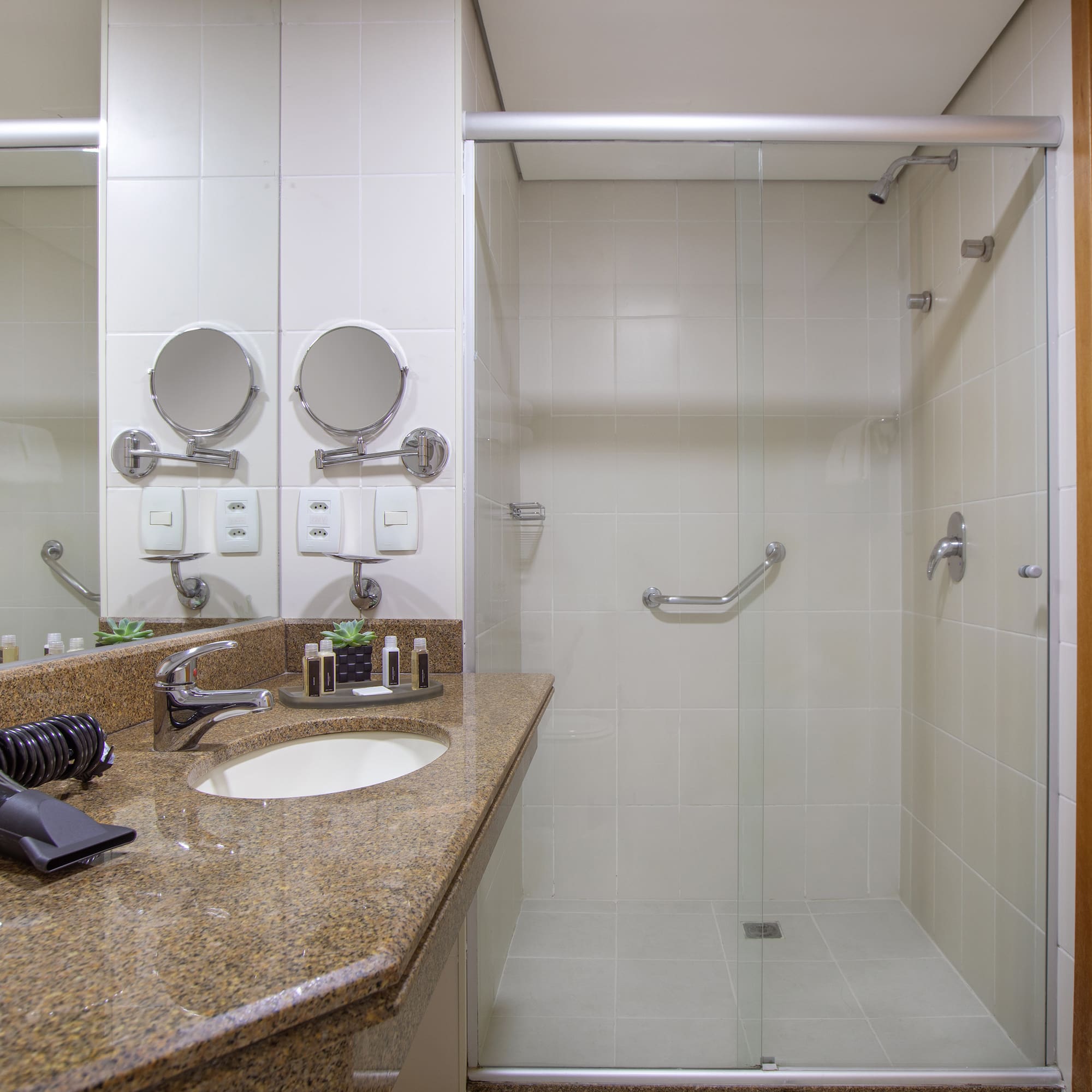 a bathroom with a shower and sink