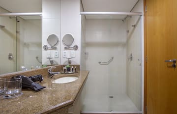 a bathroom with a shower and sink