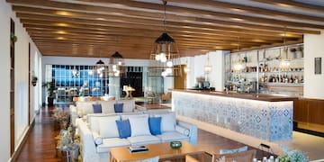 a room with a bar and a couch